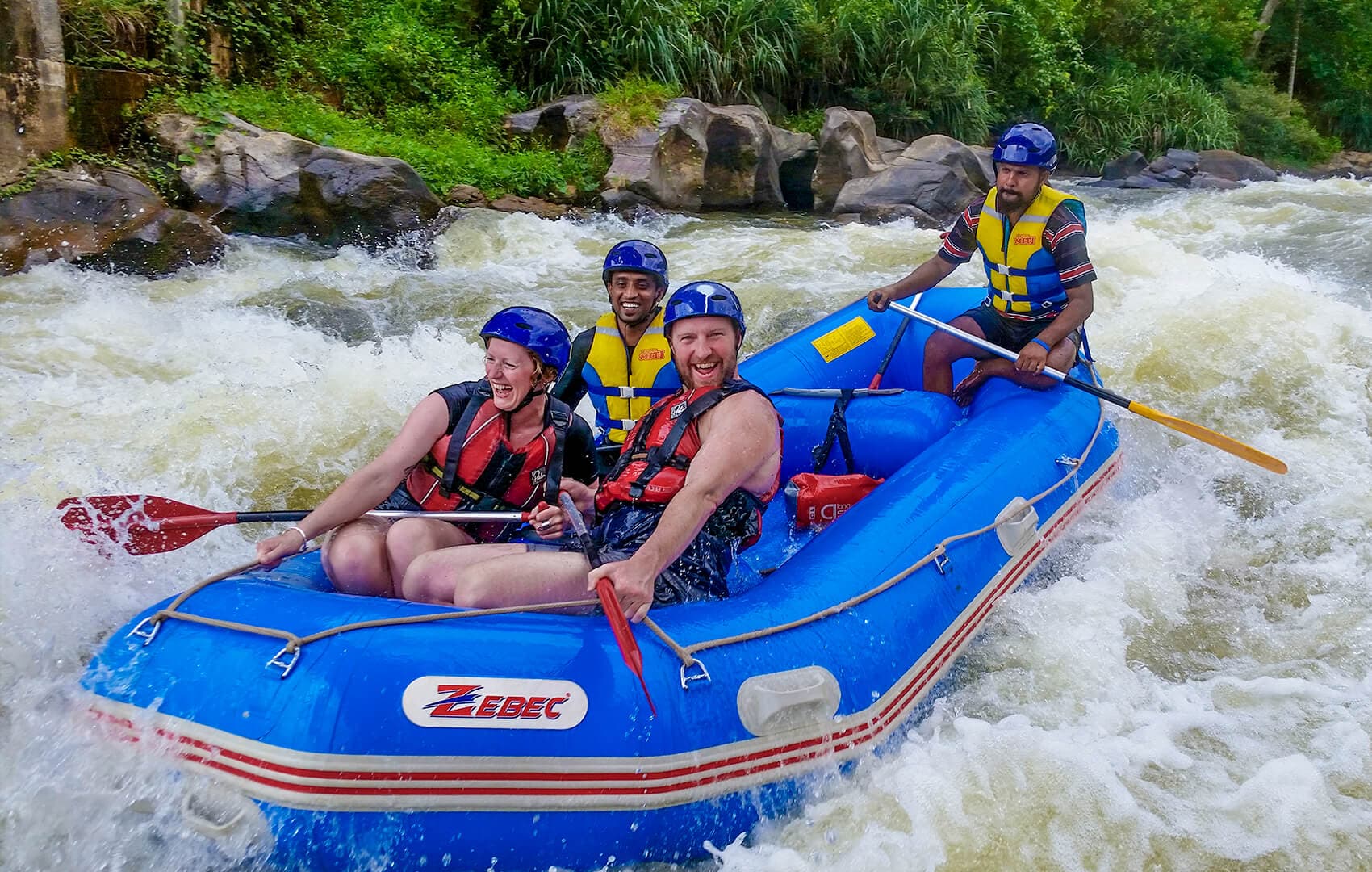 White-water rafting group paddling through rapids on the Kelani River, Kithulgala