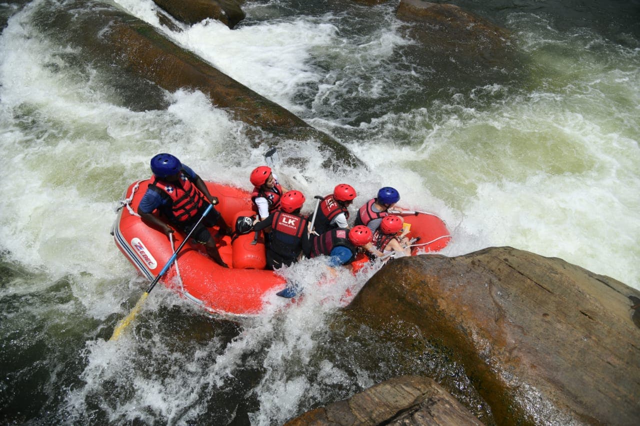 Team effort paddling through Grade 3 Kithulgala rapid section