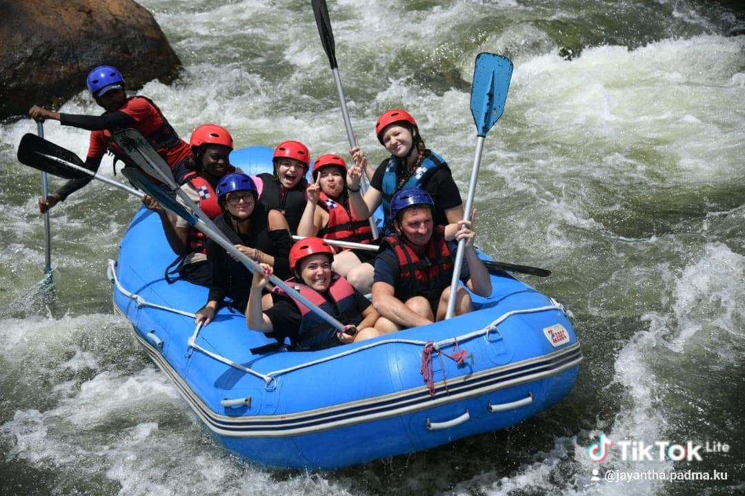 River guide giving paddle instructions on white water rapids