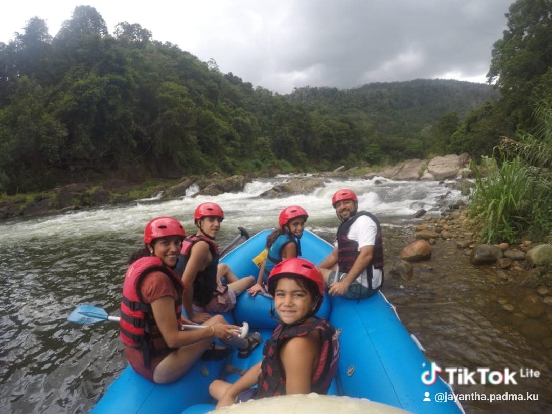 Raft crew celebrating after completing the major rapid drop