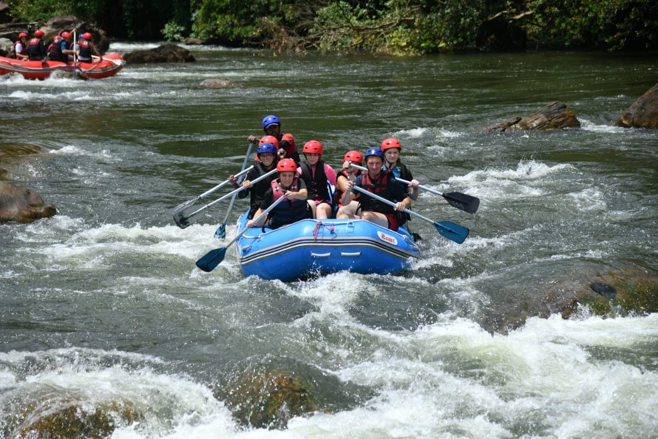 Guided white water expedition through scenic rainforest gorges
